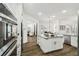 Modern kitchen features center island, stainless steel appliances, and hardwood flooring at 1301 Jen Ma Jo Ln, Lutz, FL 33549