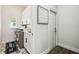 Well-lit laundry room with modern washer and dryer, white cabinets, and a countertop at 1301 Jen Ma Jo Ln, Lutz, FL 33549