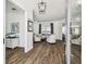Elegant living room with hardwood floors, ample natural light, and an open floor plan at 1301 Jen Ma Jo Ln, Lutz, FL 33549
