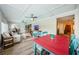 Cozy living room with coffered ceilings, and lots of natural light from windows at 1306 Coppertree Dr, Tarpon Springs, FL 34689