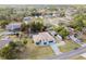 Aerial view of the property showcasing the home, driveway and neighborhood at 13635 Coronado Dr, Spring Hill, FL 34609