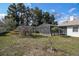 The backyard features a small garden and a large screened in pool at 13635 Coronado Dr, Spring Hill, FL 34609