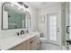 Bathroom featuring stylish lighting, black hardware, and a wood grain vanity at 13635 Coronado Dr, Spring Hill, FL 34609