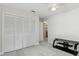Bedroom with closet, tile floors, and ceiling fan at 13635 Coronado Dr, Spring Hill, FL 34609