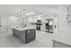 Bright kitchen featuring an island, modern appliances, and ample storage with stylish, clean design at 13635 Coronado Dr, Spring Hill, FL 34609