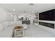 Expansive living area with a modern fireplace, open to the kitchen, perfect for entertaining and Gathering gatherings at 13635 Coronado Dr, Spring Hill, FL 34609