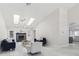 Bright living room with fireplace, skylights, marble floors and french doors to backyard at 13635 Coronado Dr, Spring Hill, FL 34609