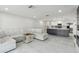 Open-concept living space that includes a living room, kitchen, and fireplace, ideal for modern living at 13635 Coronado Dr, Spring Hill, FL 34609