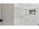 Spacious living room with tile floors and access to the screened in lanai at 13635 Coronado Dr, Spring Hill, FL 34609