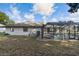 Screened pool and patio area with a hot tub and lots of privacy in the yard at 13635 Coronado Dr, Spring Hill, FL 34609