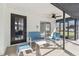 Enclosed porch with ceiling fan, furniture, and doors leading to the interior and backyard at 13635 Coronado Dr, Spring Hill, FL 34609
