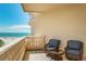 Relaxing balcony space with comfortable chairs and stunning views of the beach and ocean at 14 Somerset St # 5C, Clearwater, FL 33767