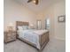 Comfortable bedroom showcasing a queen bed, neutral tones, a ceiling fan, and plantation shutters at 14 Somerset St # 5C, Clearwater, FL 33767