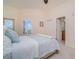 Inviting bedroom with soft hues, a queen bed, and plantation shutters allowing natural light at 14 Somerset St # 5C, Clearwater, FL 33767