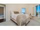 Comfortable bedroom featuring a queen bed and a window with beautiful natural light at 14 Somerset St # 5C, Clearwater, FL 33767