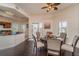 Open concept dining area with an adjacent kitchen, hardwood floors, and natural light at 14 Somerset St # 5C, Clearwater, FL 33767