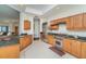 Spacious kitchen featuring stainless steel appliances, tile floors, and views of living area at 14 Somerset St # 5C, Clearwater, FL 33767