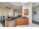 Open kitchen featuring granite countertops, stainless steel appliances, and views into the living area at 14 Somerset St # 5C, Clearwater, FL 33767