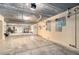 Unfinished basement with concrete floor, white walls, and ample space for storage or projects at 146 175Th Terrace E Dr, Redington Shores, FL 33708