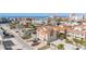 Charming multi-story home in a coastal community with inviting balconies and well-maintained landscaping at 146 175Th Terrace E Dr, Redington Shores, FL 33708