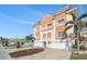 Multi-story home with garages, landscaping and tile roof on a sunny day at 146 175Th Terrace E Dr, Redington Shores, FL 33708