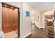 Hallway featuring an elevator, beautiful wood floors, and arched entryways at 146 175Th Terrace E Dr, Redington Shores, FL 33708