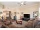 Spacious Living Room featuring a comfortable sofa, entertainment center, and stylish decor at 146 175Th Terrace E Dr, Redington Shores, FL 33708