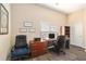 Office with wood floors, a large desk, filing cabinet, and door to another room at 146 175Th Terrace E Dr, Redington Shores, FL 33708