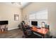 Well-lit office space with dark wood floors, desk, shelves, and a large window at 146 175Th Terrace E Dr, Redington Shores, FL 33708