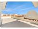 Expansive rooftop terrace featuring stucco walls and panoramic neighborhood views under a clear blue sky at 146 175Th Terrace E Dr, Redington Shores, FL 33708