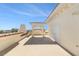 Rooftop deck with stucco walls, tile accents, and views of the surrounding neighborhood and blue sky at 146 175Th Terrace E Dr, Redington Shores, FL 33708