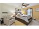 Comfortable bedroom with neutral tones and a decorative ceiling fan, creating a relaxing and inviting atmosphere at 15721 Starling Water Dr, Lithia, FL 33547