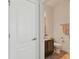 Modern half bathroom featuring a granite vanity and a ceramic tile floor at 15721 Starling Water Dr, Lithia, FL 33547