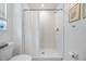 Modern bathroom featuring shower with white subway tile and glass door at 21404 Darter Rd, Land O Lakes, FL 34638