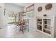 Dining area featuring a modern table set, slider doors to the backyard and tile floors at 21404 Darter Rd, Land O Lakes, FL 34638