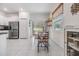 Bright dining area with tile floors, a view of the backyard through sliding glass doors and plenty of natural light at 21404 Darter Rd, Land O Lakes, FL 34638