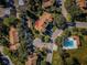 Aerial view of the property and its location relative to a parking lot and a community pool at 2180 Clover Hill Rd, Palm Harbor, FL 34683