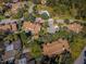 Aerial view of community featuring mature trees, community pool and ample parking at 2180 Clover Hill Rd, Palm Harbor, FL 34683