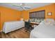 Bright guest bedroom with twin beds, desk, window, and bamboo flooring at 2180 Clover Hill Rd, Palm Harbor, FL 34683