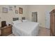 Cozy bedroom features a comfy bed, bedside table, and decorative wall art at 2180 Clover Hill Rd, Palm Harbor, FL 34683