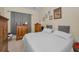Bedroom with neutral colored walls and updated furniture at 2180 Clover Hill Rd, Palm Harbor, FL 34683