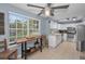 Spacious kitchen with views of a dinette, and stainless steel refrigerator and stove at 2180 Clover Hill Rd, Palm Harbor, FL 34683