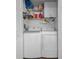 Closet-style laundry room with updated washer and dryer at 2180 Clover Hill Rd, Palm Harbor, FL 34683
