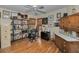 Inviting home office featuring a desk, bookcase, bamboo shades, and natural light at 2180 Clover Hill Rd, Palm Harbor, FL 34683