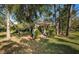 Picturesque pergola nestled among trees, offering a serene outdoor space at 2180 Clover Hill Rd, Palm Harbor, FL 34683