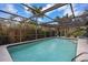 Inviting screened pool with clear blue water offers a refreshing escape in a private outdoor setting at 2221 59Th S St, Gulfport, FL 33707