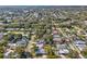 Wide aerial view of the residential neighborhood, highlighting tree coverage and nearby streets at 2530 Sunset Dr, Largo, FL 33770