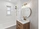 Bright bathroom with a tub, vanity, and modern fixtures at 2530 Sunset Dr, Largo, FL 33770