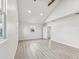 Bright, spacious bedroom with wood-look flooring, and vaulted ceilings at 2530 Sunset Dr, Largo, FL 33770