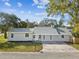Charming single story home with a well-maintained lawn and freshly painted exterior at 2530 Sunset Dr, Largo, FL 33770